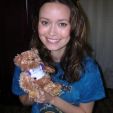Summer holds a signed bear