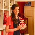 Summer Glau holding a vintage doll in Help for the Holidays