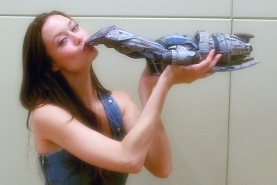 Summer Glau kisses a Serenity scale model at Dallas Comic Con 2012
